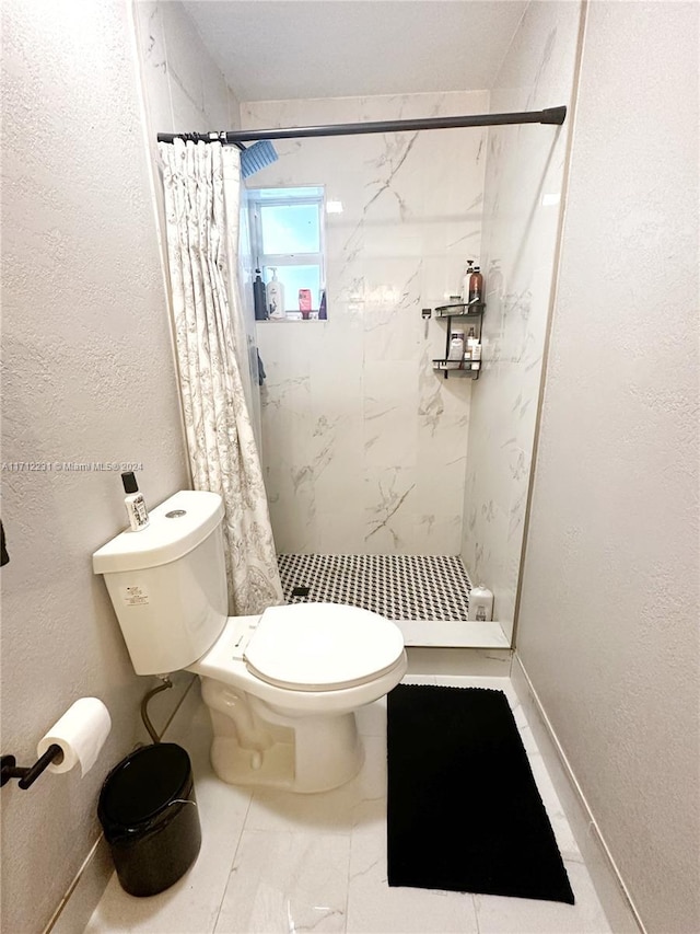 bathroom with toilet and walk in shower