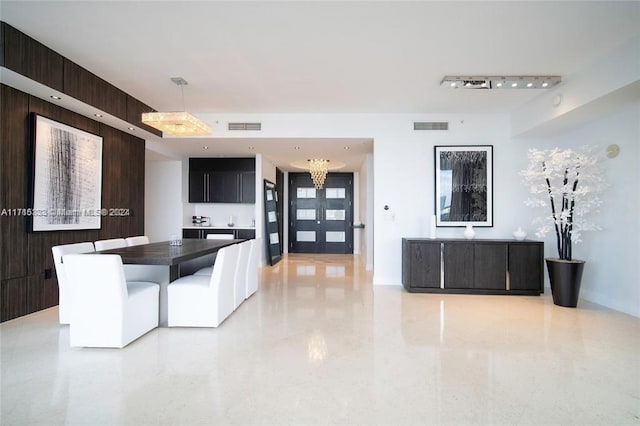 unfurnished dining area featuring wooden walls