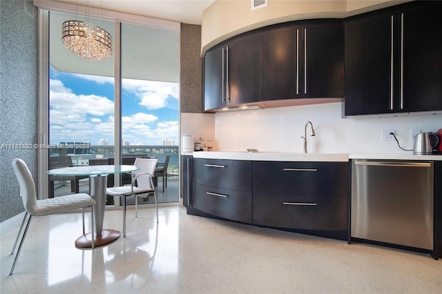 kitchen featuring dishwasher and decorative light fixtures