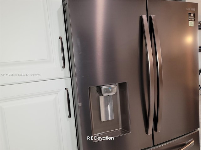 interior details featuring stainless steel fridge with ice dispenser