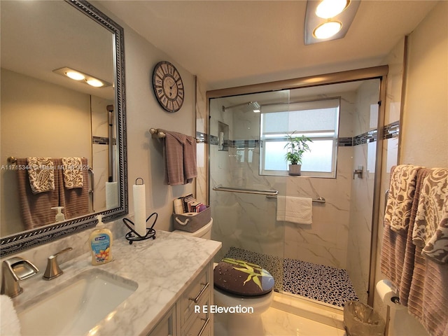 bathroom featuring toilet, a shower with door, and vanity