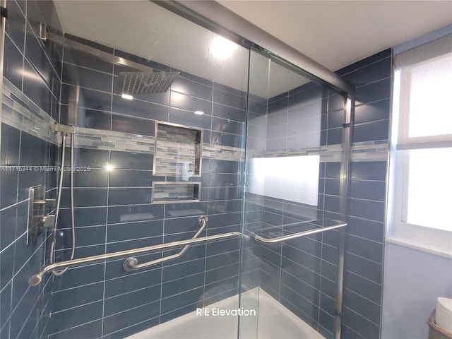 bathroom with a shower with shower door