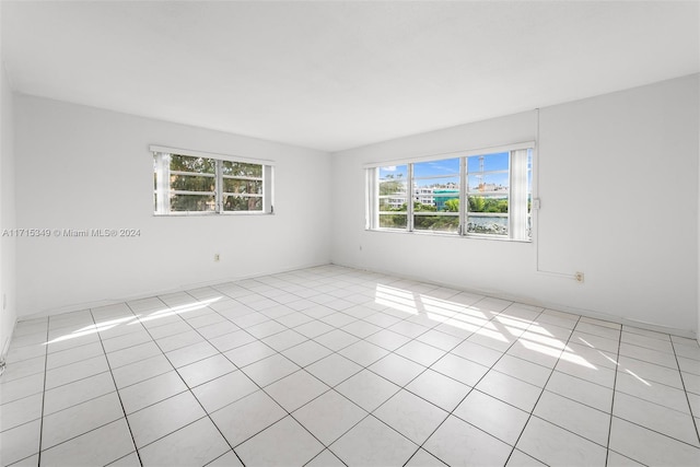 unfurnished room with light tile patterned floors