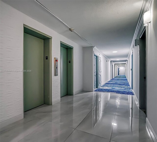 1849 S Ocean Dr Unit 409, Hallandale Beach, FL 33009 - hallway with elevator and crown molding