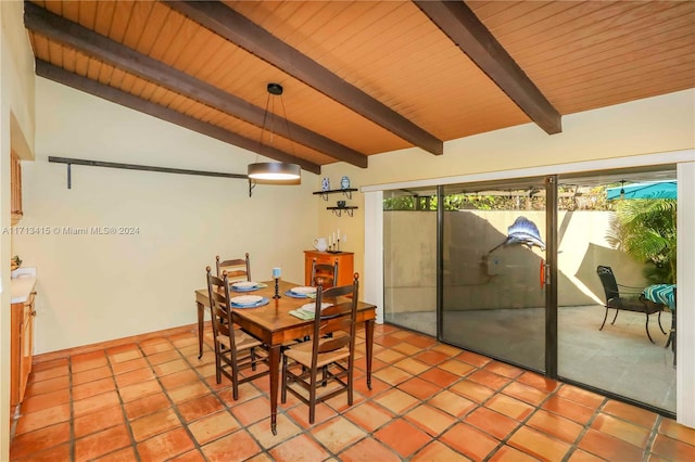 tiled dining space featuring lofted ceiling with beams and wooden ceiling