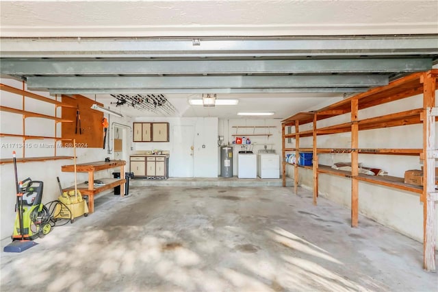 garage with independent washer and dryer and water heater