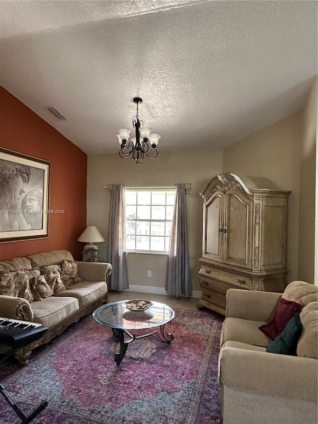 living room featuring a textured ceiling, lofted ceiling, and a notable chandelier