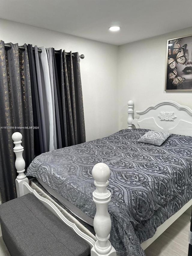 bedroom featuring wood finished floors