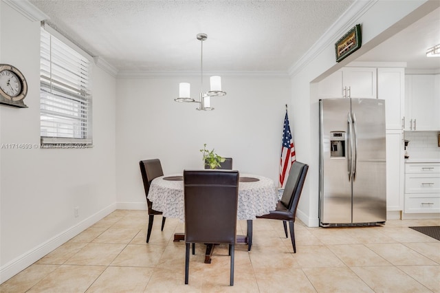 dining space featuring light tile patterned floors, an inviting chandelier, a textured ceiling, and ornamental molding