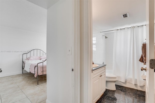 full bathroom with vanity, shower / tub combo, and toilet