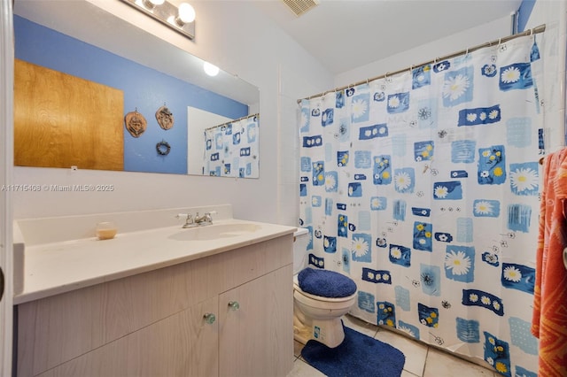 bathroom with a shower with shower curtain, vanity, toilet, and tile patterned flooring