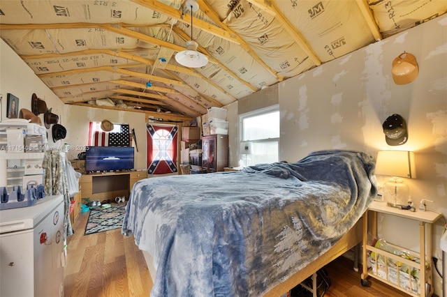 bedroom featuring lofted ceiling and wood-type flooring