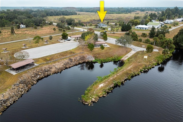 birds eye view of property with a water view