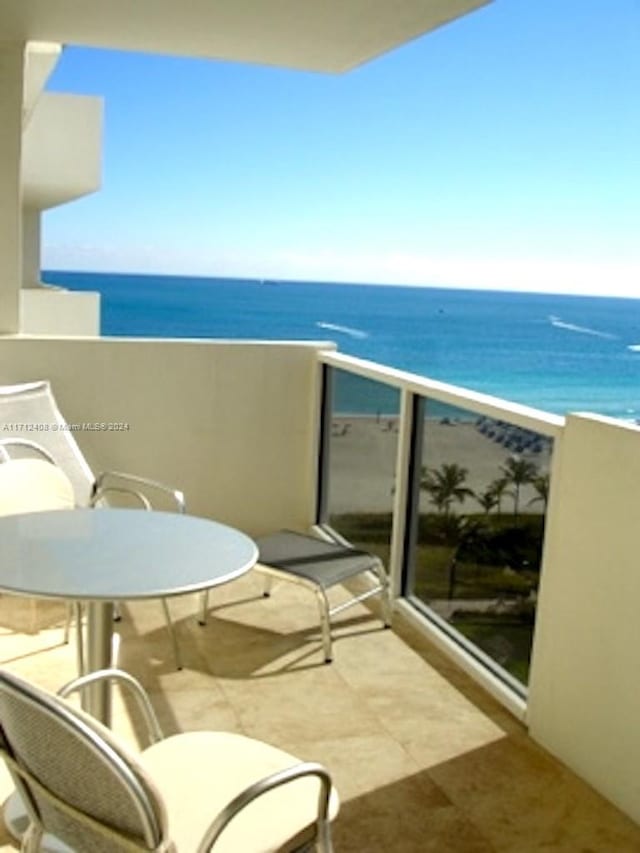 balcony featuring a water view