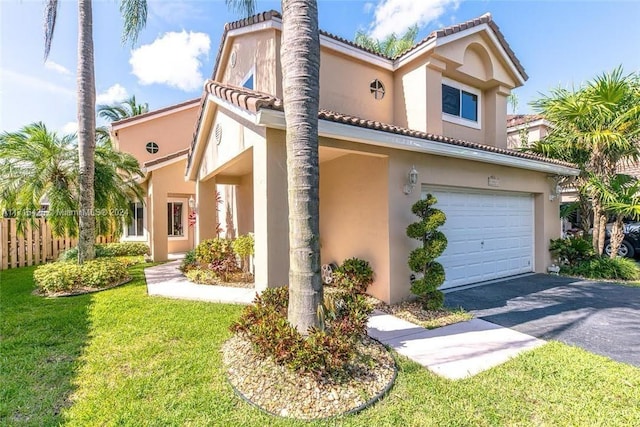 view of front of home featuring a front lawn and a garage