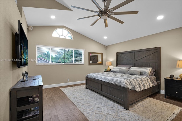 bedroom with ceiling fan, vaulted ceiling, and light hardwood / wood-style flooring