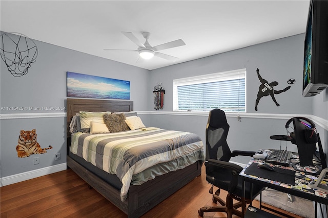 bedroom featuring ceiling fan and dark hardwood / wood-style floors