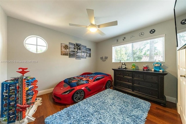 bedroom featuring ceiling fan and dark hardwood / wood-style flooring