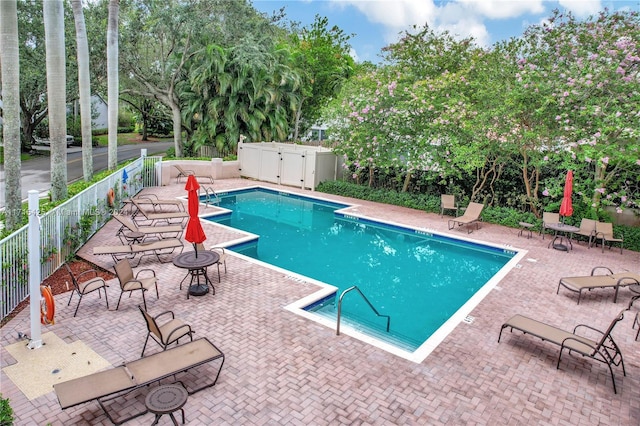 view of swimming pool with a patio