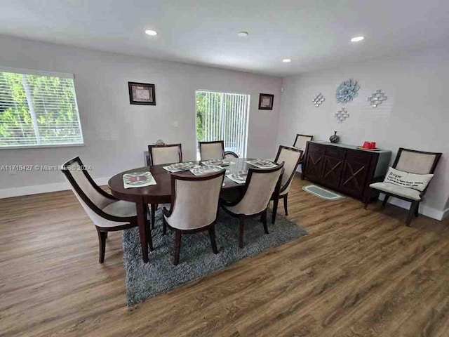 dining room with dark hardwood / wood-style flooring