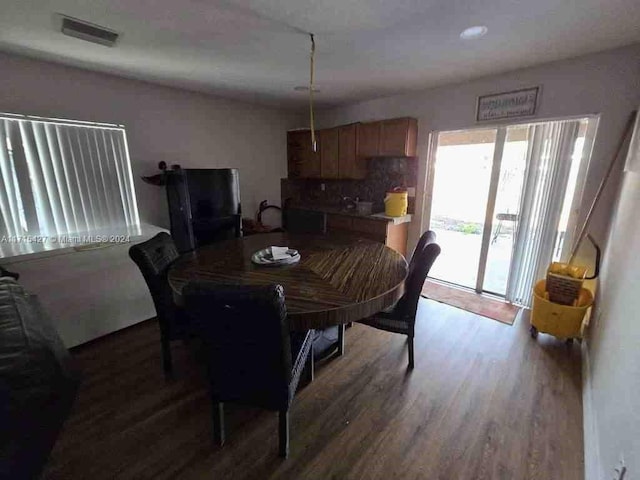 dining room with dark wood-type flooring