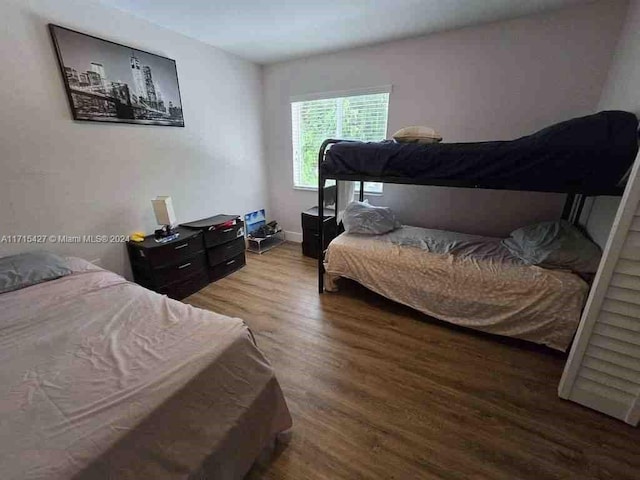 bedroom featuring wood-type flooring