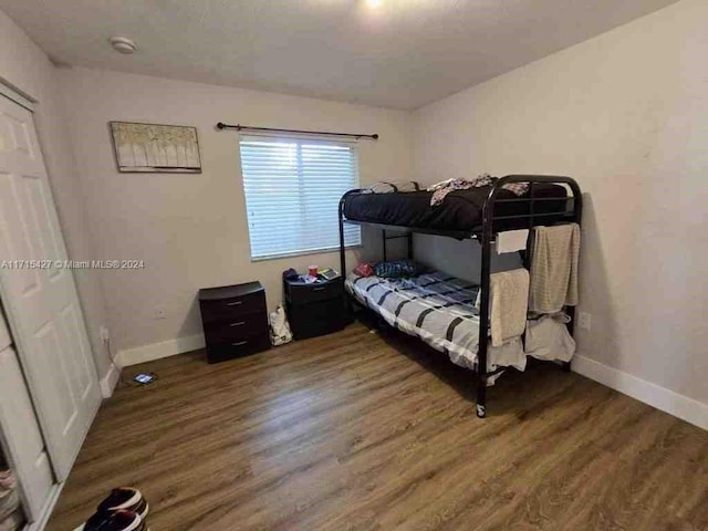 bedroom featuring dark hardwood / wood-style floors