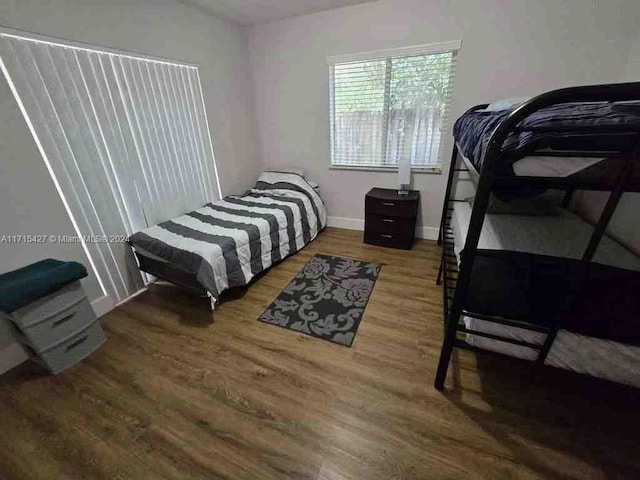 bedroom with wood-type flooring