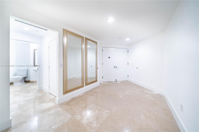 interior space featuring baseboards and recessed lighting