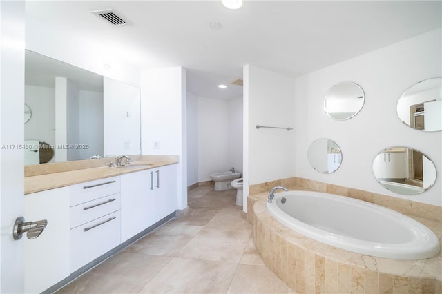 full bathroom with visible vents, toilet, tile patterned floors, vanity, and a bidet