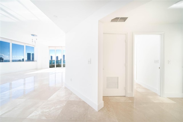 hallway featuring expansive windows