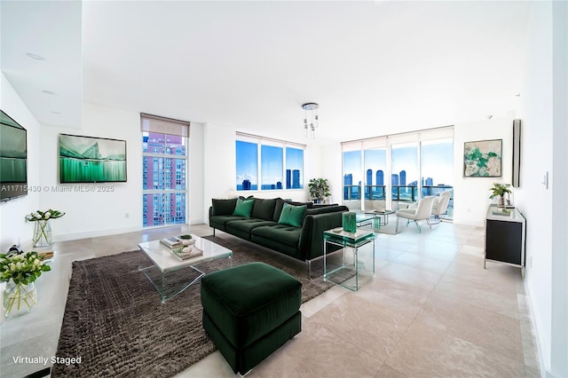 living room with light tile patterned floors and floor to ceiling windows