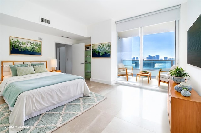 bedroom featuring visible vents and baseboards