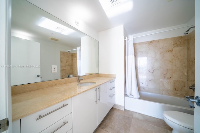 bathroom with toilet, shower / tub combo, visible vents, and vanity