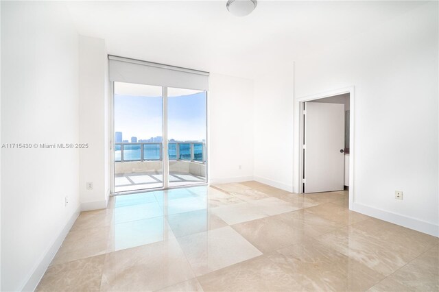 full bathroom with toilet, tiled shower / bath combo, tile patterned flooring, and vanity