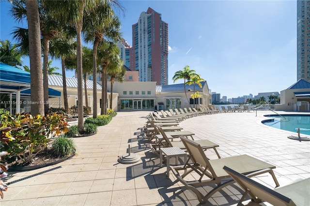 view of swimming pool featuring a patio area