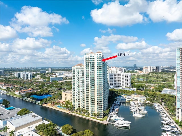 birds eye view of property featuring a water view and a city view