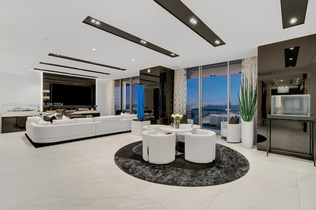 living room with floor to ceiling windows