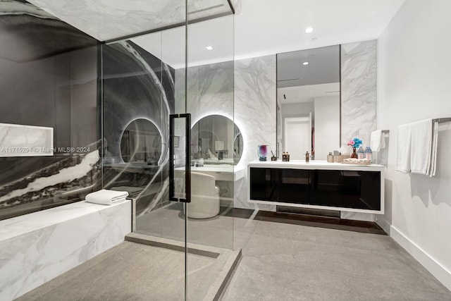 bathroom featuring vanity and a shower with shower door