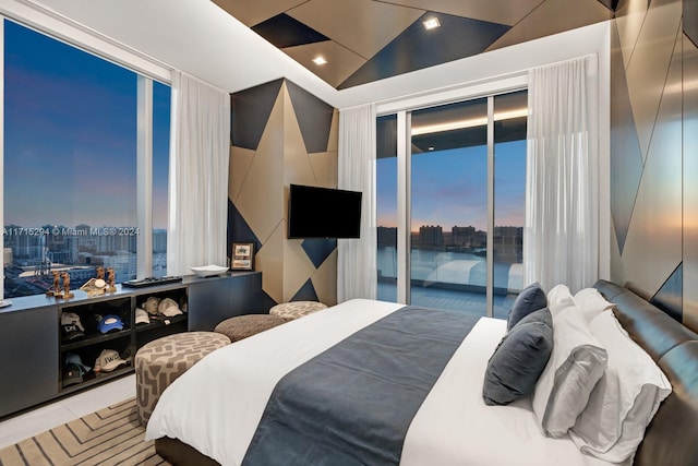 bedroom featuring access to exterior and vaulted ceiling