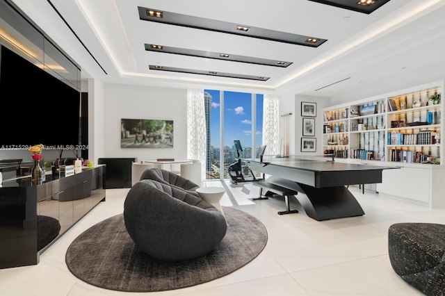 interior space featuring light tile patterned floors, a tray ceiling, and expansive windows