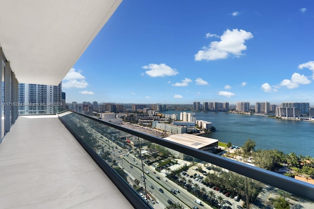 balcony featuring a water view