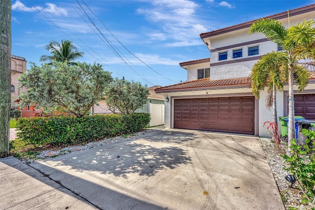 garage with concrete driveway