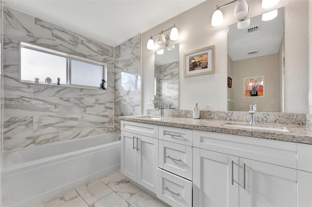 bathroom featuring a sink, visible vents, and marble finish floor