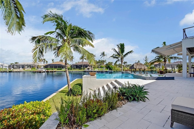 view of swimming pool with a water view