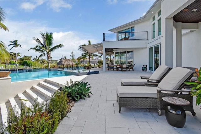 view of swimming pool with a patio area