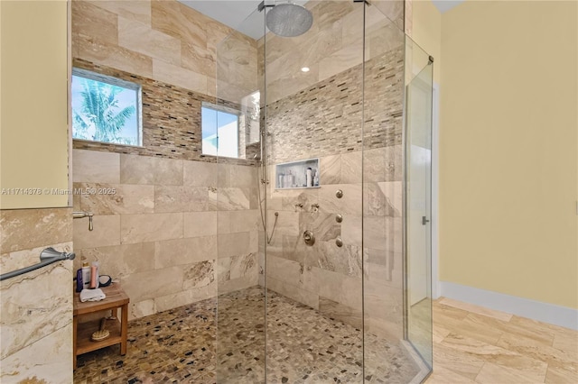 bathroom with tiled shower