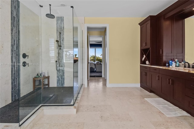 bathroom with an enclosed shower and vanity