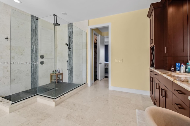 bathroom with vanity and a shower with shower door