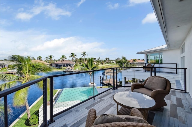 balcony featuring a water view